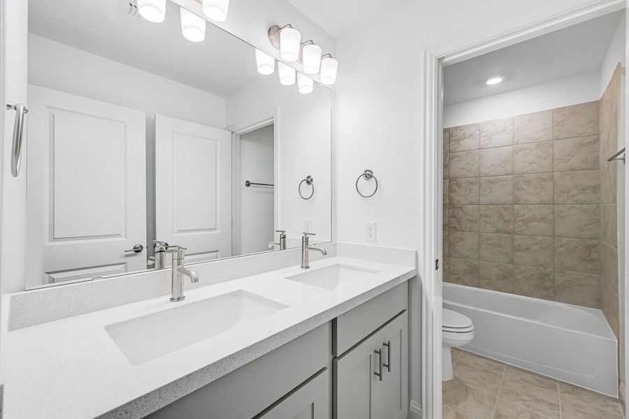 Representative furnished interior of a home built from the Camelia by Taylor Morrison in Stoneridge, Melissa (Image 14).