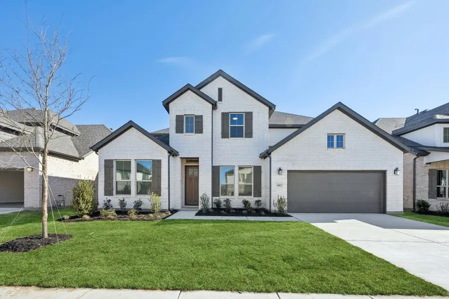 Front exterior of a new home in Painted Tree Lakeside, McKinney, TX, highlighting curb appeal (Image 1). Front exterior of a new home in Painted Tree Lakeside, McKinney, TX, highlighting curb appeal (Image 1).