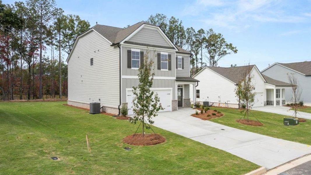 Front exterior of a new home in Parkside at Carter Grove, Cartersville, GA, highlighting curb appeal (Image 23).