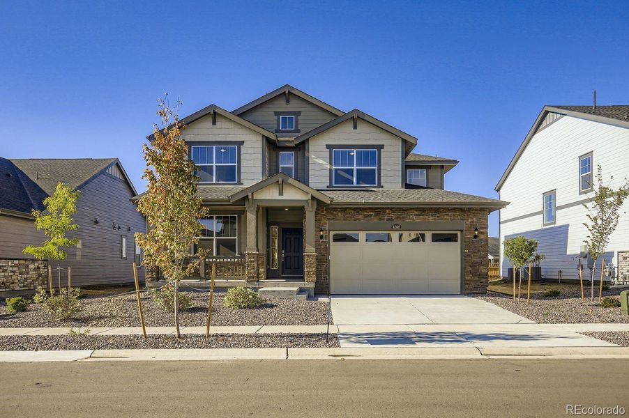 Front exterior of a new home in Ledge Rock: The Monarch Collection, Johnstown, CO, highlighting curb appeal (Image 12).