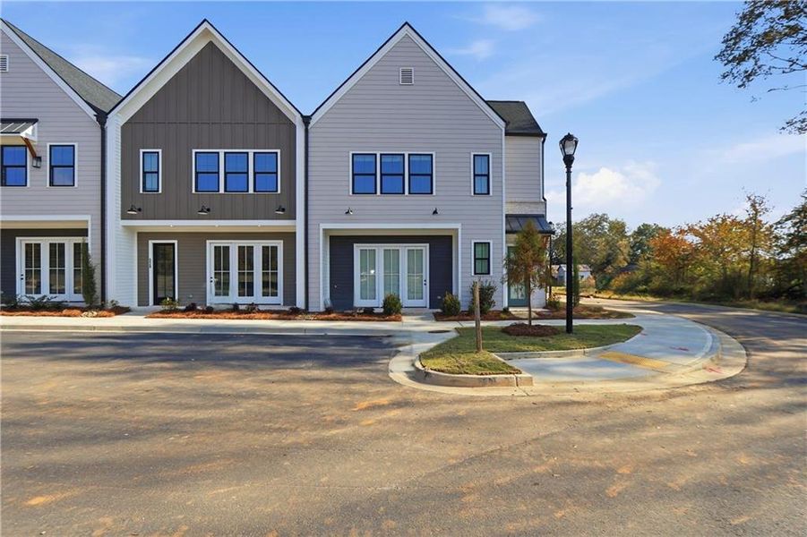 Front exterior of a new home in , Braselton, GA, highlighting curb appeal (Image 2).