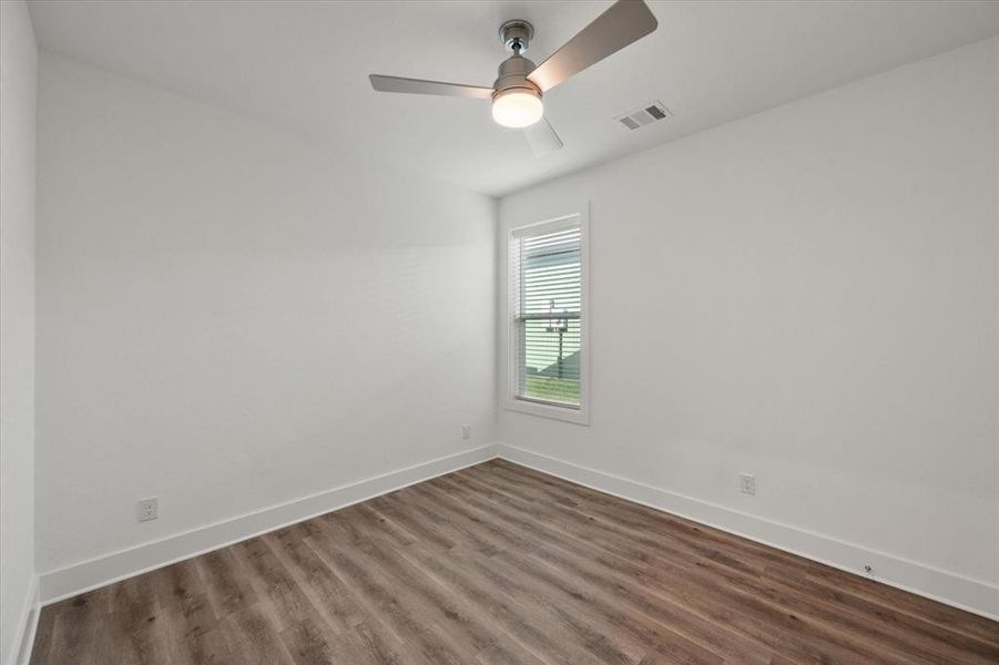 Bedroom featuring baseboards and LVP wood-type flooring, ceiling fan and nice size closet.