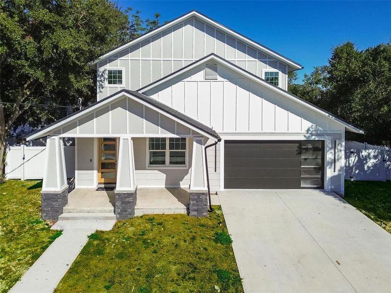 Front exterior of a new home in , Tampa, FL, highlighting curb appeal (Image 23).
