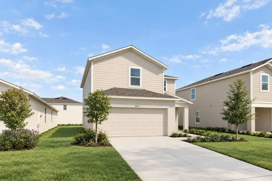 Representative exterior photo of a completed home built from the Dove by Taylor Morrison in Azure at Solaeris, Port St. Lucie, FL (Image 21).