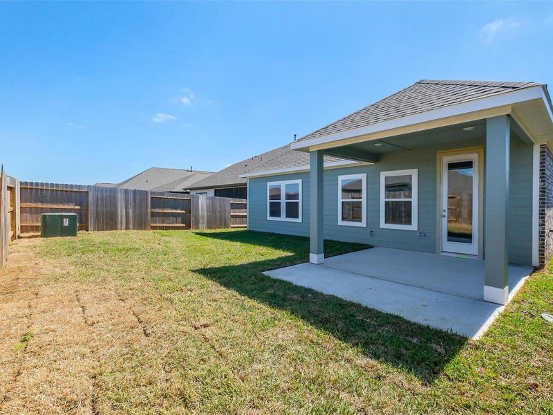 Exterior details and patio area of a home in Sunterra, Katy (Image 26).
