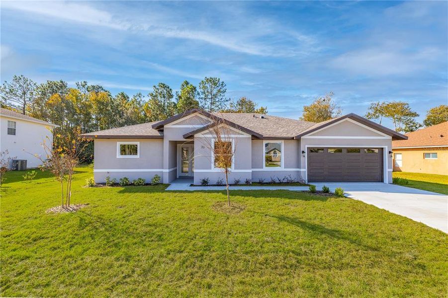 Front exterior of a new home in , Palm Coast, FL, highlighting curb appeal (Image 1).