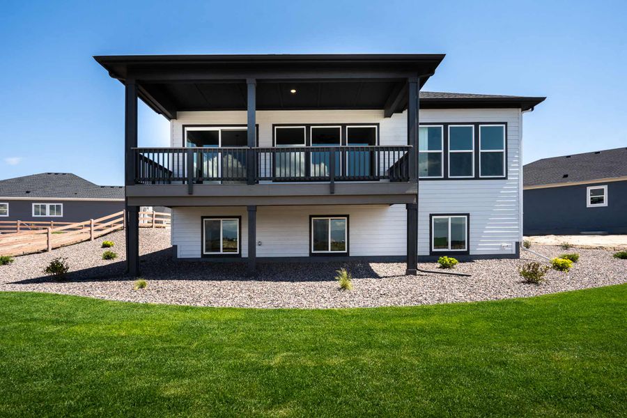 Representative exterior photo of a completed home built from the The Glisen by David Weekley Homes in Wolf Ranch - Enclave Collection, Colorado Springs, CO (Image 1).