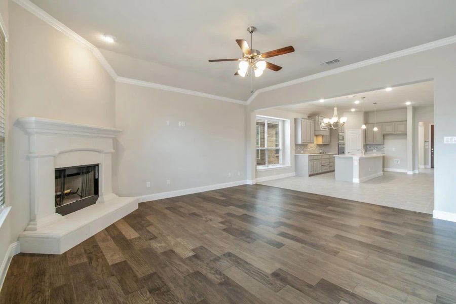 Family Room to Kitchen | Concept 2129 at Redden Farms - Classic Series in Midlothian, TX by Landsea Homes