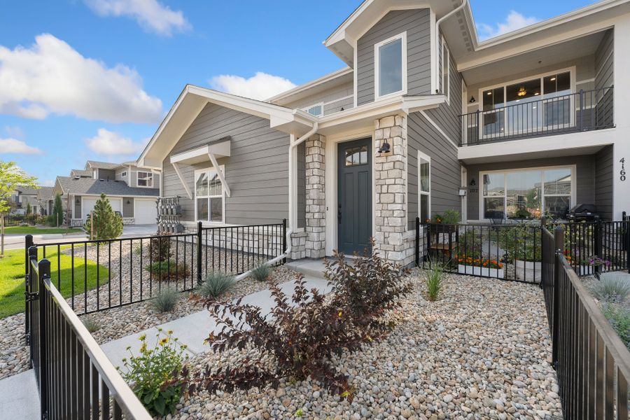 Exterior details and patio area of a home in The Lakes at Centerra, Loveland (Image 4).