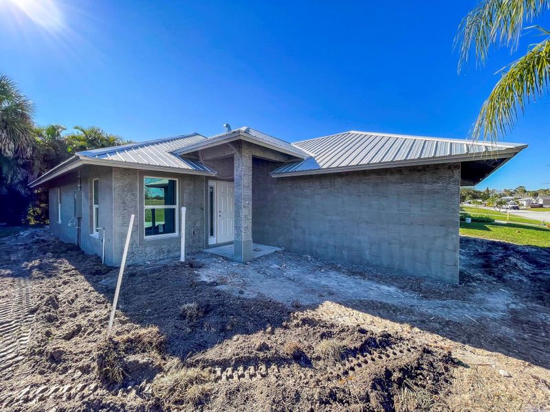 Front exterior of a new home in , Okeechobee, FL, highlighting curb appeal (Image 1). Front exterior of a new home in , Okeechobee, FL, highlighting curb appeal (Image 1).