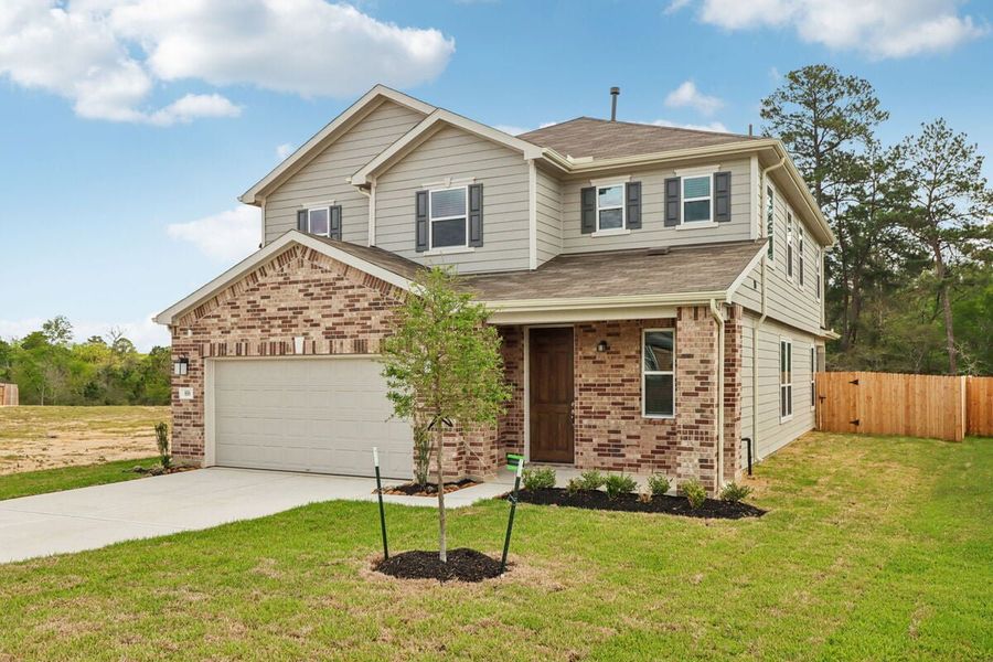 Front exterior of a new home in Mustang Ridge, Magnolia, TX, highlighting curb appeal (Image 1). Front exterior of a new home in Mustang Ridge, Magnolia, TX, highlighting curb appeal (Image 1).