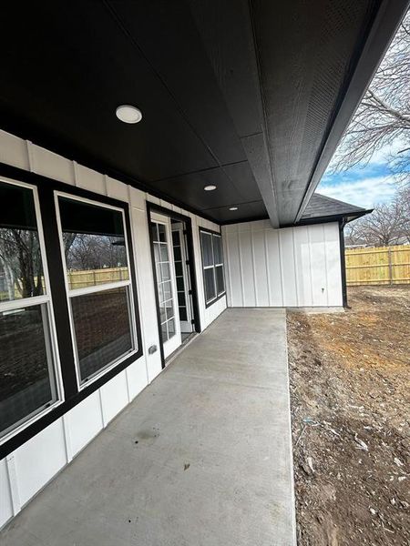 View of patio with fence