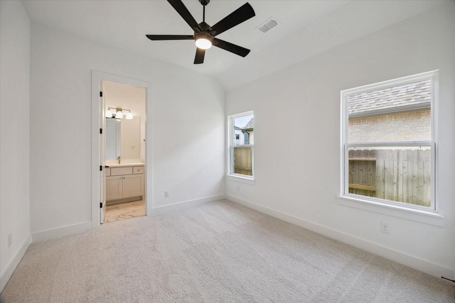 1 of the 3 Secondary Bedrooms. Complete with ensuite Bath and walk-in closet.