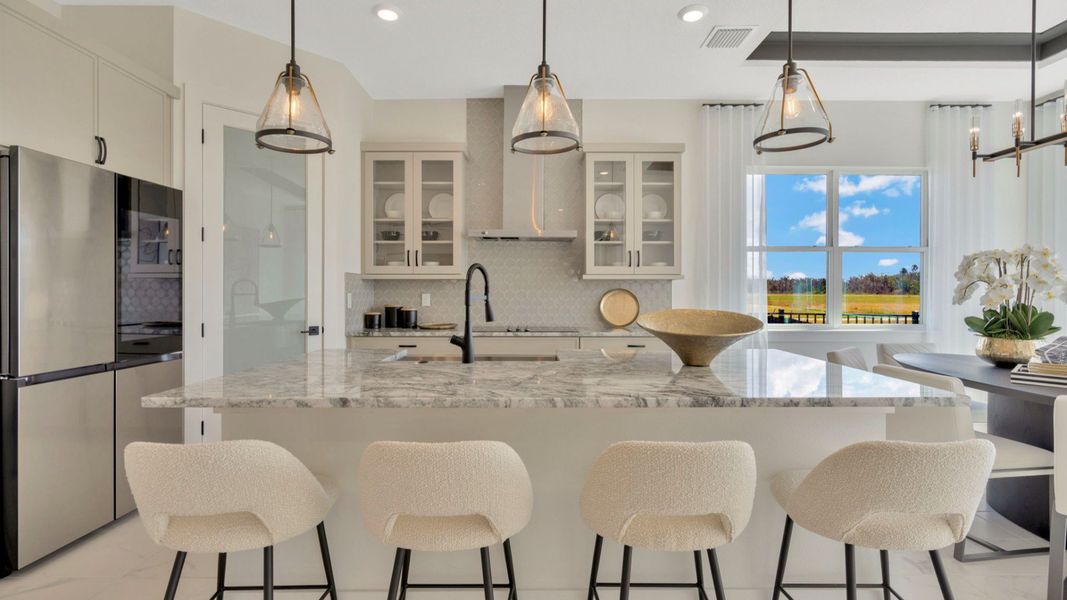The Kitchen of a DRB Homes Grand Eider model, which is a home plan offered at Serengeti in Spring Hill, FL.