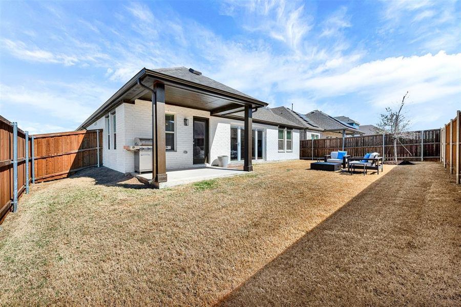 Exterior details and patio area of a home in Woodstone, Providence Village (Image 22). Exterior details and patio area of a home in Woodstone, Providence Village (Image 22).