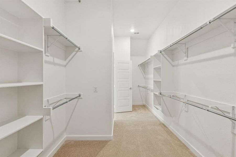 Primary Closet in the Da Vinci II home plan by Trophy Signature Homes – REPRESENTATIVE PHOTO