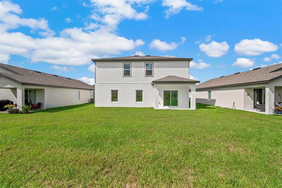 Exterior details and patio area of a home in Peach Crossings, Winter Haven (Image 3).