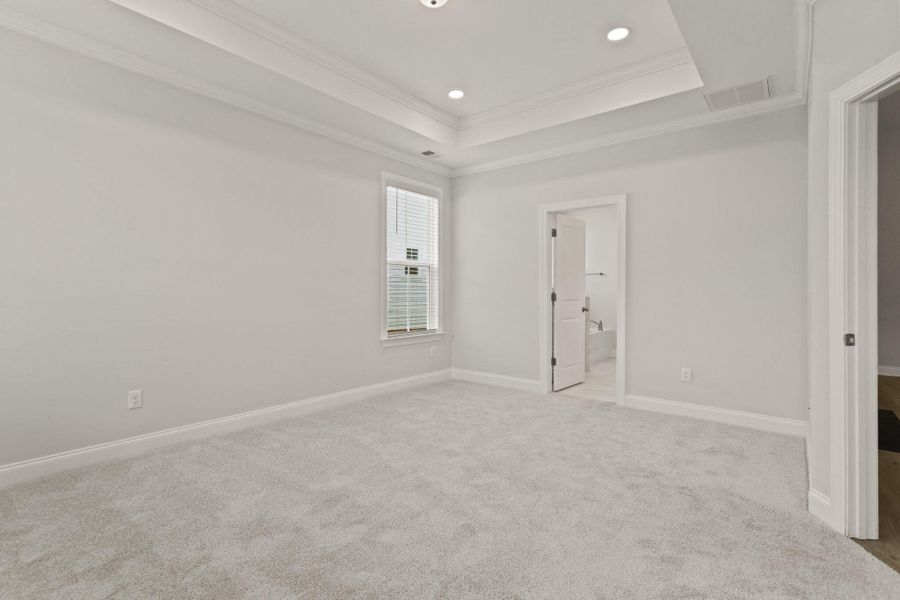Spacious, unfurnished interior of a new home in Tidewater at Lakes of Cane Bay, Summerville (Image 23).