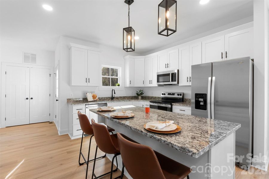 Kitchen with shaker cabinet, granite countertops and stainless steel appliances Kitchen with shaker cabinet, granite countertops and stainless steel appliances