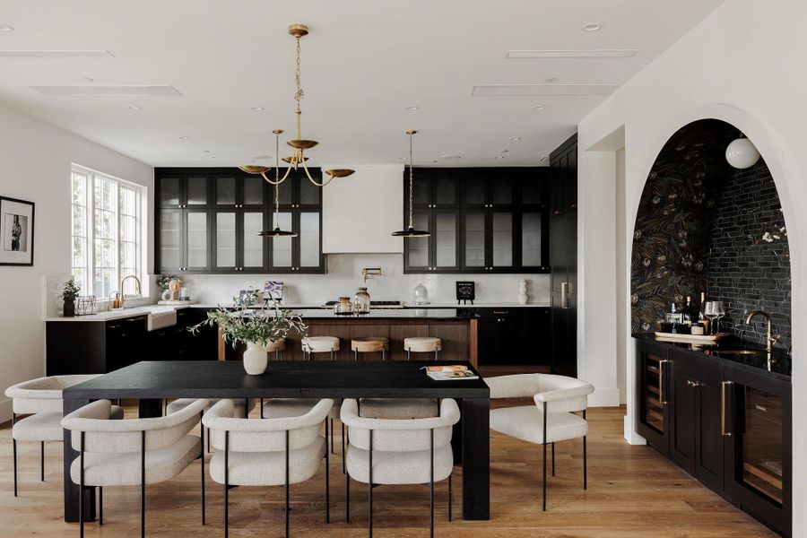 A culinary delight designed for both performance and beauty, featuring Wolf and Sub-Zero appliances, a hidden scullery, and a waterfall stone island. A culinary delight designed for both performance and beauty, featuring Wolf and Sub-Zero appliances, a hidden scullery, and a waterfall stone island.