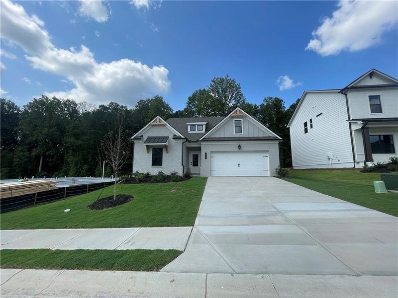 Front exterior of a new home in Summerlin, Winder, GA, highlighting curb appeal (Image 22).