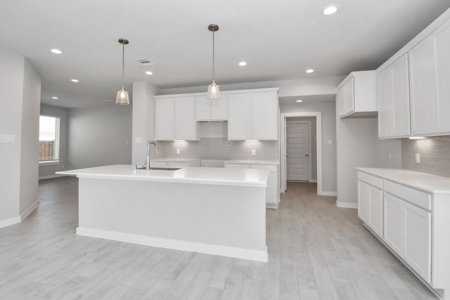 The extended counter area adds both practicality and style, making meal preparation a breeze. Every detail is thoughtfully designed to enhance the kitchen's functionality and aesthetic appeal. The extended counter area adds both practicality and style, making meal preparation a breeze. Every detail is thoughtfully designed to enhance the kitchen's functionality and aesthetic appeal.