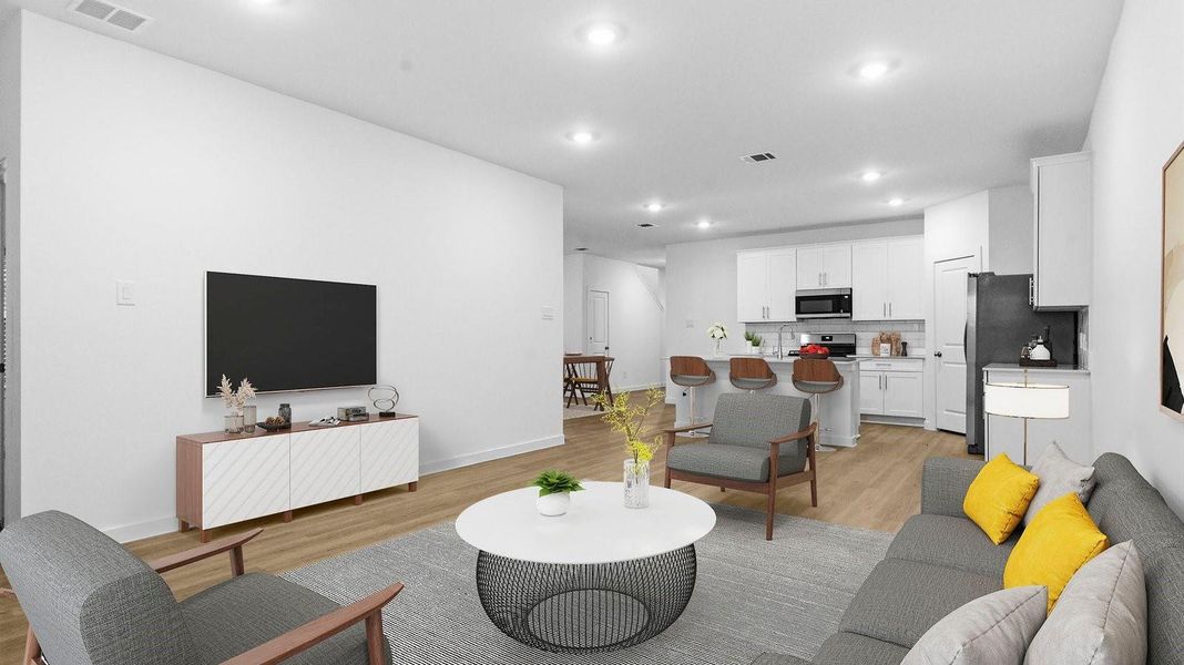 A cozy living room featuring a comfortable couch, a stylish coffee table, and an elegant painting on the wall. A cozy living room featuring a comfortable couch, a stylish coffee table, and an elegant painting on the wall.