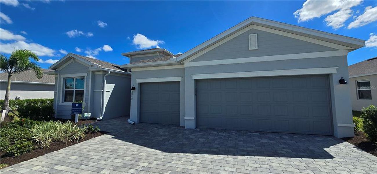 Front exterior of a new home in , Englewood, FL, highlighting curb appeal (Image 1). Front exterior of a new home in , Englewood, FL, highlighting curb appeal (Image 1).