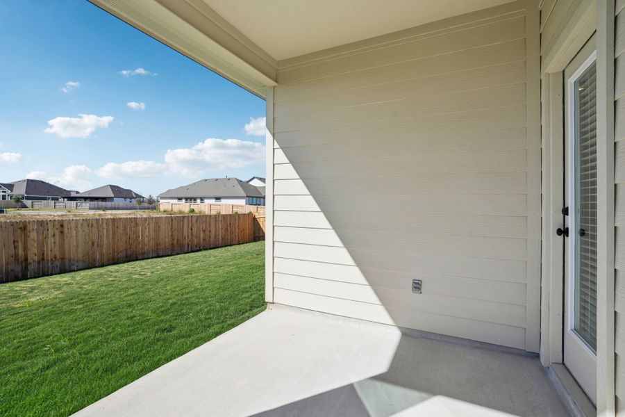 Exterior details and patio area of a home in Village at Three Oaks, Seguin (Image 3).