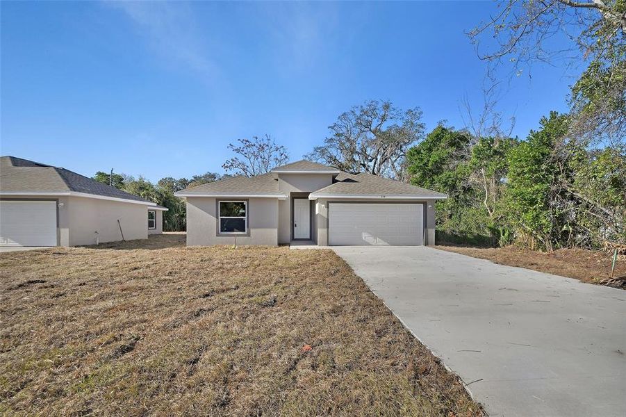 Front exterior of a new home in , Daytona Beach, FL, highlighting curb appeal (Image 2). Front exterior of a new home in , Daytona Beach, FL, highlighting curb appeal (Image 2).