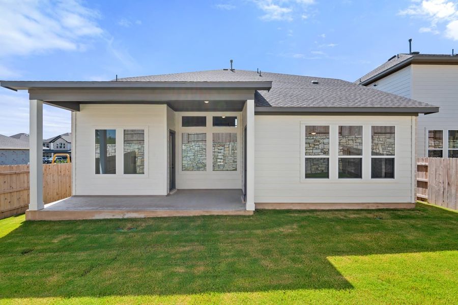 Front exterior of a new home in Park Collection at Lariat, Liberty Hill, TX, highlighting curb appeal (Image 26). Front exterior of a new home in Park Collection at Lariat, Liberty Hill, TX, highlighting curb appeal (Image 26).