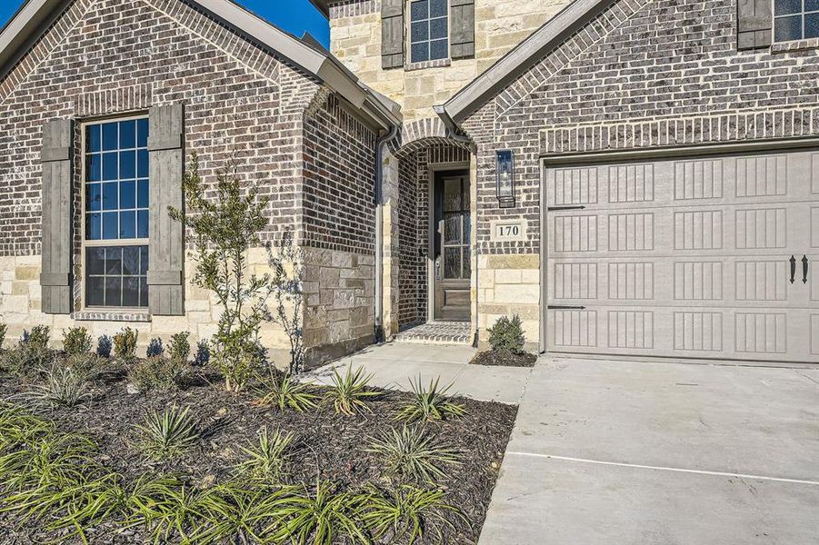 Property entrance with a garage