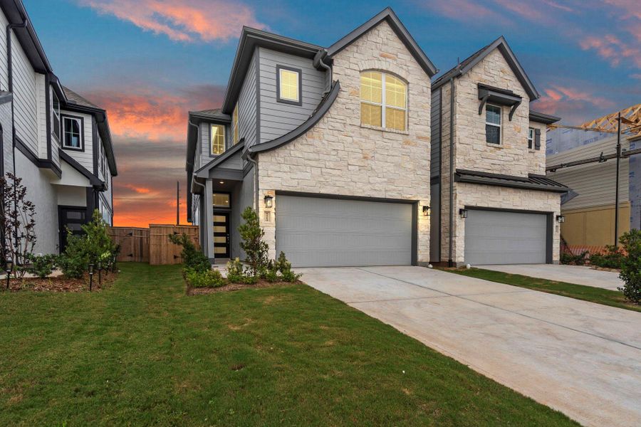 Front exterior of a new home in Sienna, Missouri City, TX, highlighting curb appeal (Image 2). Front exterior of a new home in Sienna, Missouri City, TX, highlighting curb appeal (Image 2).