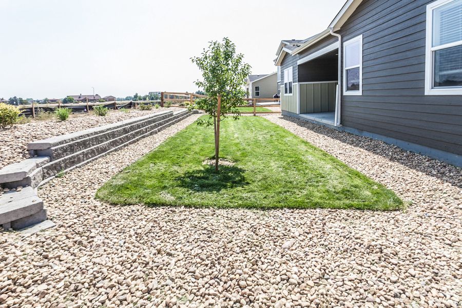 Exterior details and patio area of a home in Prairie Song, Windsor (Image 30).