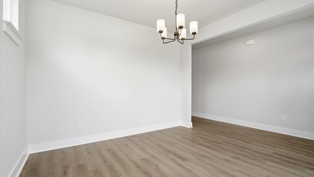 Established charm meets modern elegance in this first-rate dining room by DRB Homes
