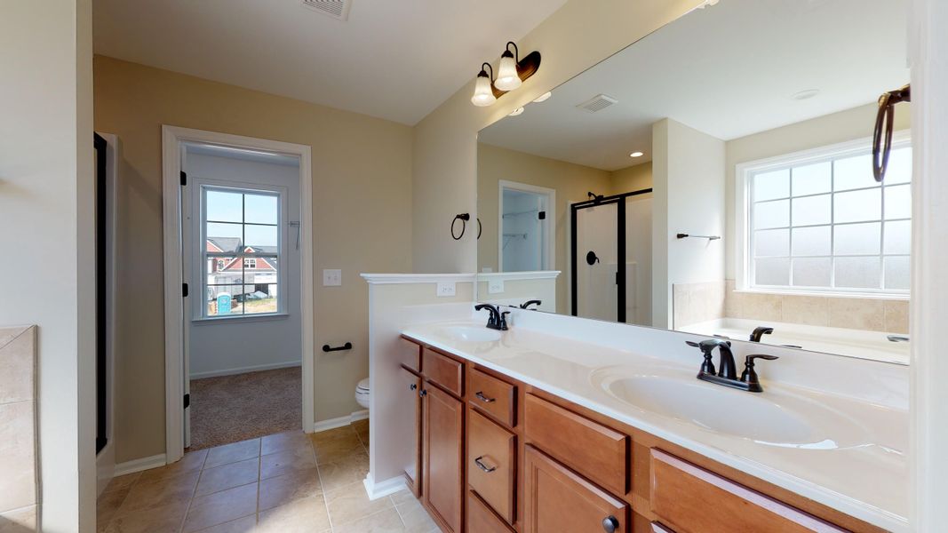 Representative furnished interior of a home built from the Rockbridge by Bill Clark Homes in Davenport Farms, Winterville (Image 13).