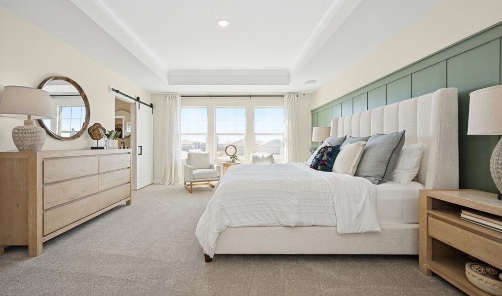 Primary suite with decorative feature wall