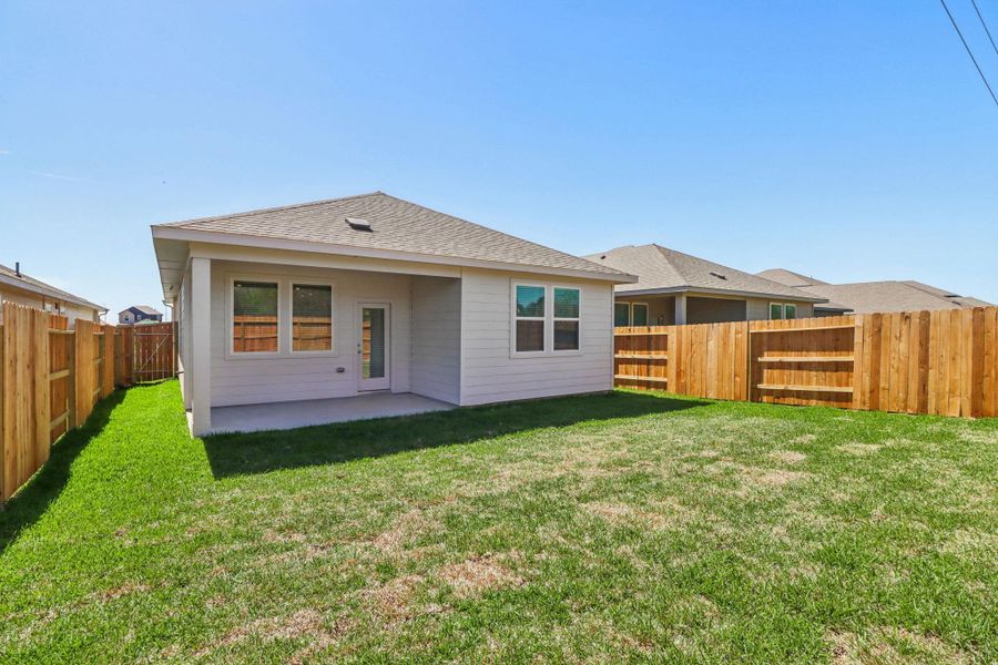 Exterior details and patio area of a home in Sanford Farms - Traditional Series, Conroe (Image 23).