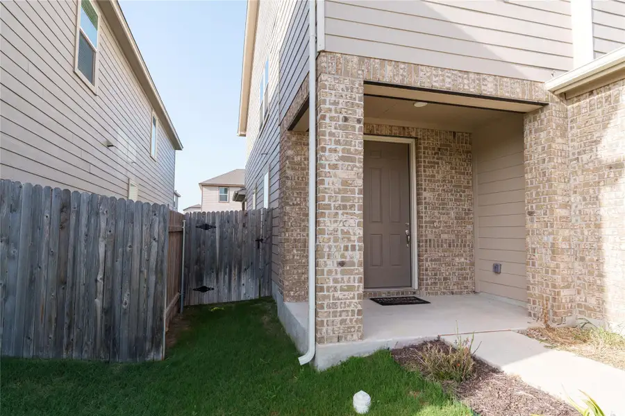 A welcoming brick and siding facade with a covered entry beckons guests inside. A welcoming brick and siding facade with a covered entry beckons guests inside.
