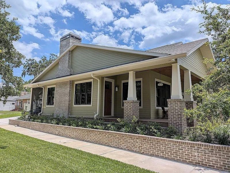 Side of home with extended porch