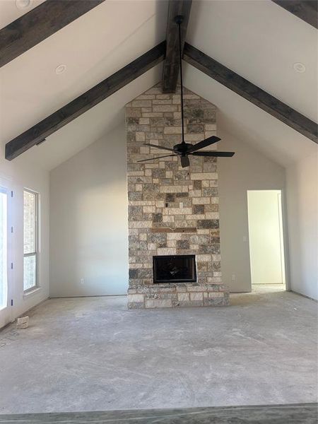 Large living with cathedral ceiling, stained beams and double back patio door Large living with cathedral ceiling, stained beams and double back patio door