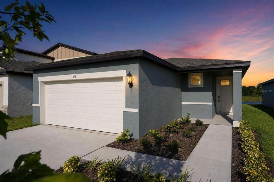 Front exterior of a new home in Magnolia Bay - Premier Series, Nokomis, FL, highlighting curb appeal (Image 2). Front exterior of a new home in Magnolia Bay - Premier Series, Nokomis, FL, highlighting curb appeal (Image 2).