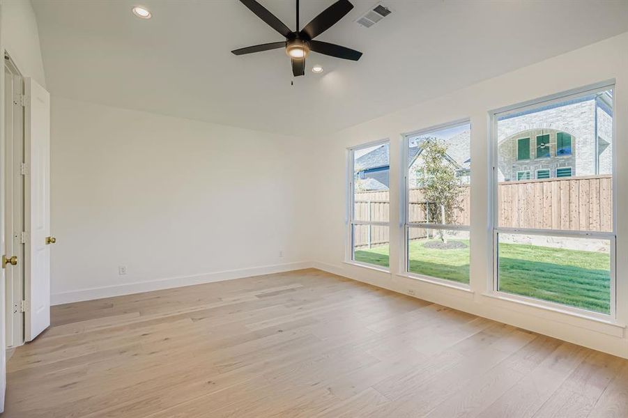 Spare room with light wood finished floors, recessed lighting, and ceiling fan Spare room with light wood finished floors, recessed lighting, and ceiling fan