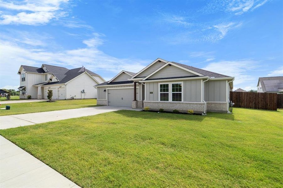 Front exterior of a new home in The Gables At Tioga, Tioga, TX, highlighting curb appeal (Image 2). Front exterior of a new home in The Gables At Tioga, Tioga, TX, highlighting curb appeal (Image 2).