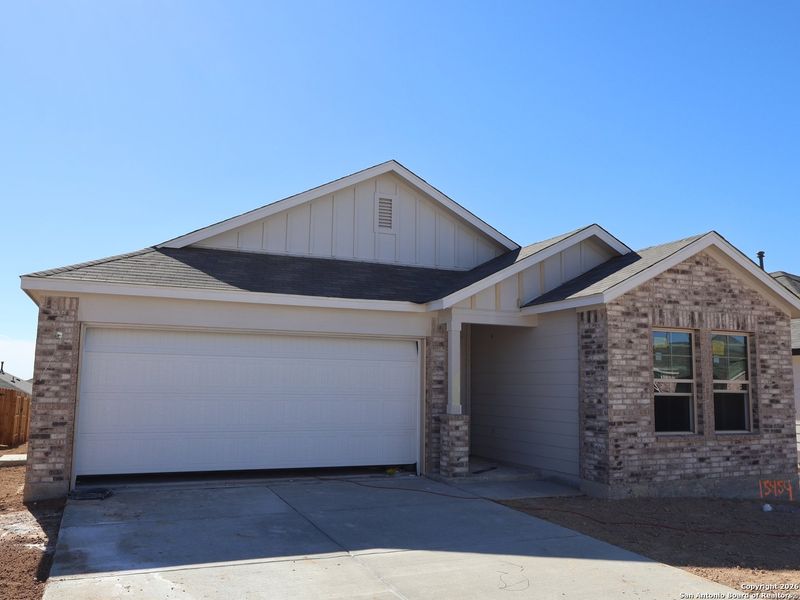 Front exterior of a new home in Hunters Ranch, San Antonio, TX, highlighting curb appeal (Image 20). Front exterior of a new home in Hunters Ranch, San Antonio, TX, highlighting curb appeal (Image 20).