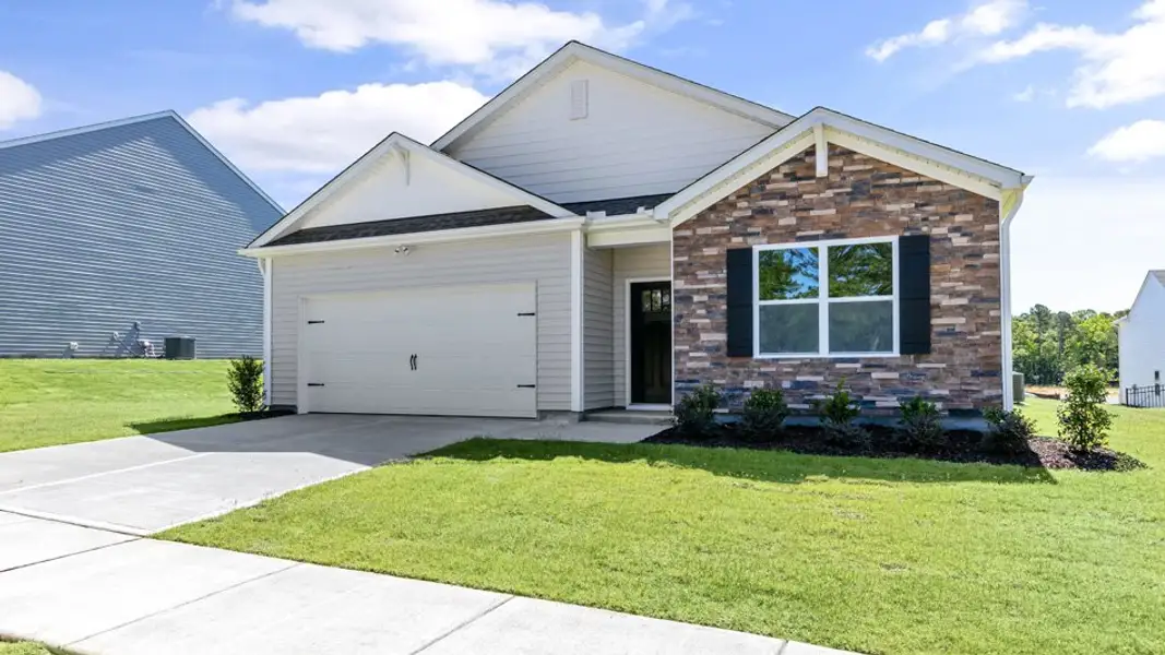 Front exterior of a new home in The Landing at Winston Pointe, Clayton, NC, highlighting curb appeal (Image 2). Front exterior of a new home in The Landing at Winston Pointe, Clayton, NC, highlighting curb appeal (Image 2).