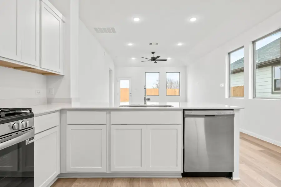 Kitchen in the Birch home plan by Trophy Signature Homes – REPRESENTATIVE PHOTO