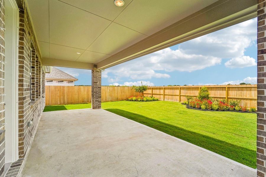 Relax outdoors on the huge covered patio Relax outdoors on the huge covered patio