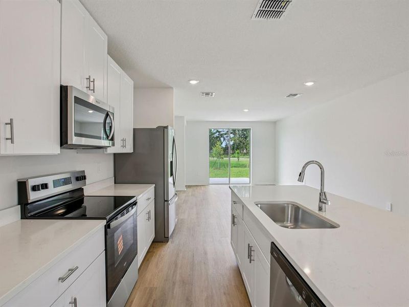 Furnished interior view inside a new home in Coasterra - Premier Series, Palmetto (Image 5). Furnished interior view inside a new home in Coasterra - Premier Series, Palmetto (Image 5).