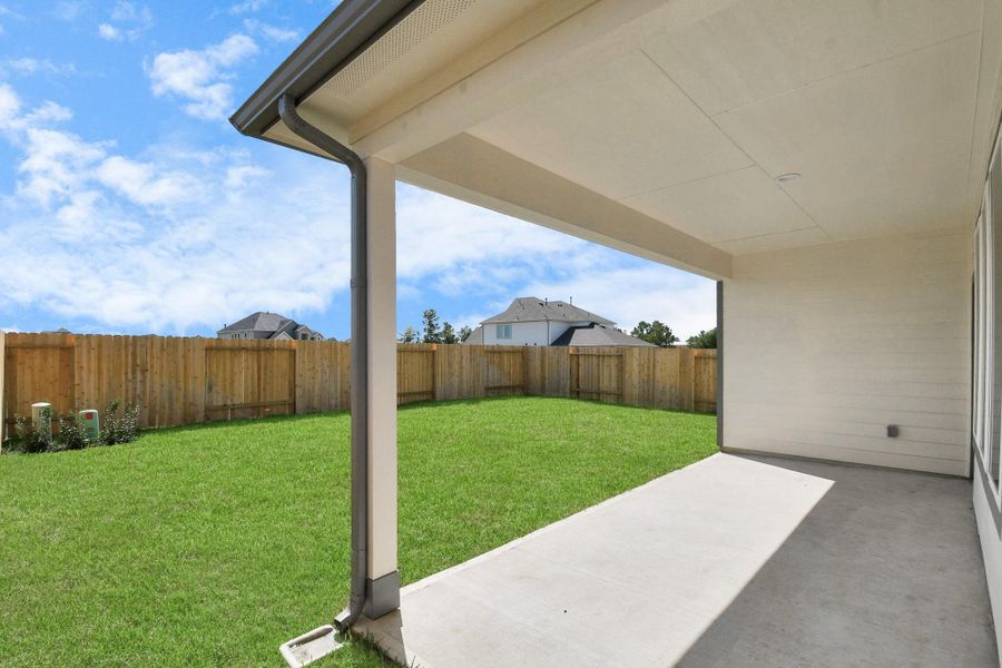 Come and see this spacious backyard with its beautiful covered patio. There is plenty of room for the kids to play and adults to relax. Perfect for your outdoor living space, patio furniture, bbq pit, and so much more. The possibilities are endless! Sample photo of completed home with similar floor plan. Actual colors and selections may vary. Come and see this spacious backyard with its beautiful covered patio. There is plenty of room for the kids to play and adults to relax. Perfect for your outdoor living space, patio furniture, bbq pit, and so much more. The possibilities are endless! Sample photo of completed home with similar floor plan. Actual colors and selections may vary.